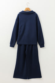 Navy textured polo set with wide-leg culottes and a geometric pattern.
