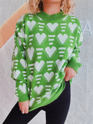 Neon green acrylic knit jumper with white geometric heart pattern, crew neck, long sleeves.