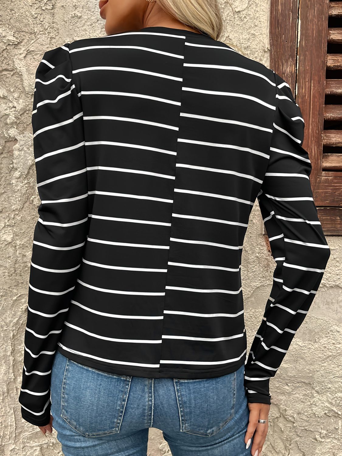 Black and white striped long sleeve top with gathered puff sleeves.