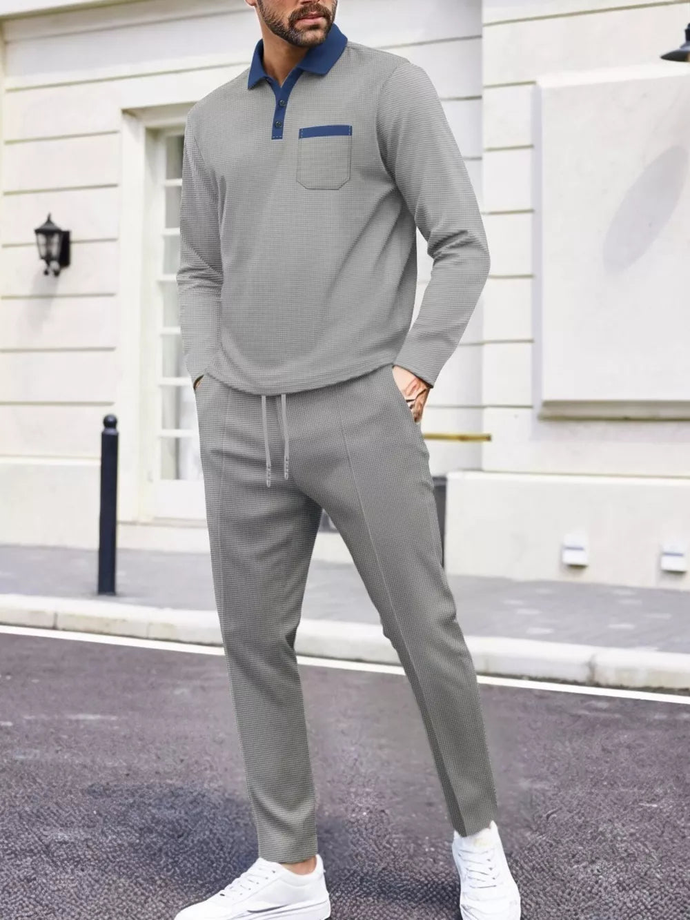 Men's gray two-piece lounge set with polo shirt and drawstring pants.
