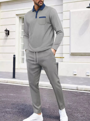 Men's gray two-piece lounge set with polo shirt and drawstring pants.