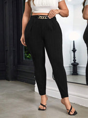 Chic black maternity pants with high waist and gold chain detail.