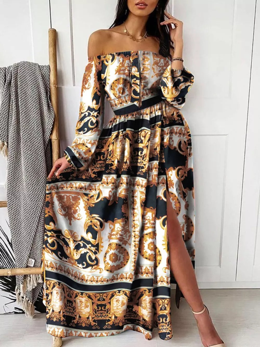 Off-shoulder maxi dress with baroque print, balloon sleeves, and a high slit in Gold Black.
