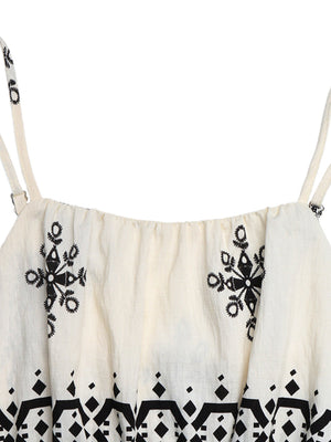 Beige romper with spaghetti straps, elastic neckline, and black folk-inspired embroidery and geometric print.