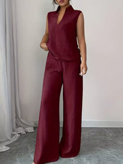 Burgundy sleeveless collared top and wide-leg pants set with textured fabric.