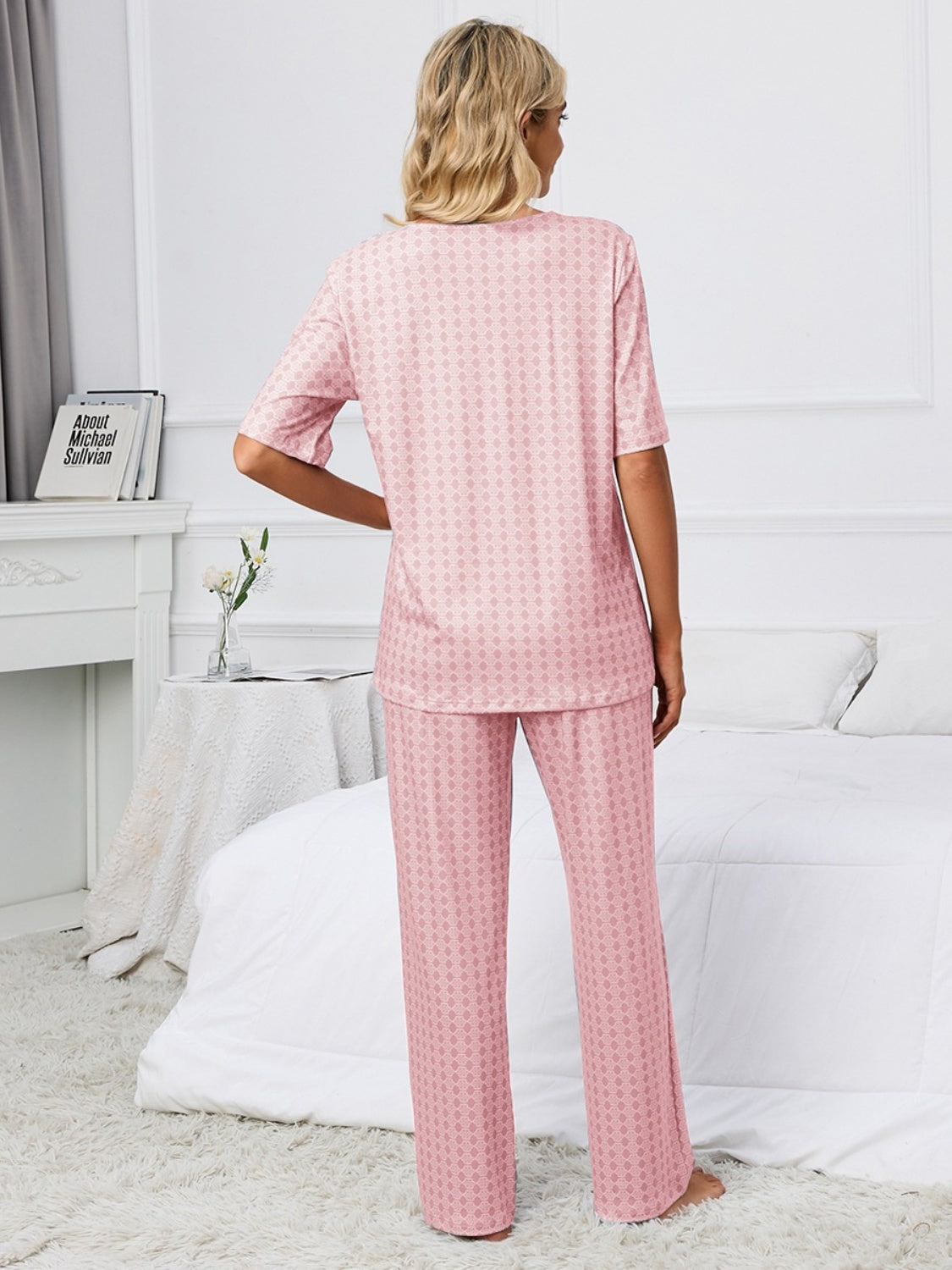 Dusty pink geometric print V-neck lounge set with short sleeves and wide-leg pants.