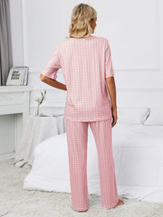 Dusty pink geometric print V-neck lounge set with short sleeves and wide-leg pants.