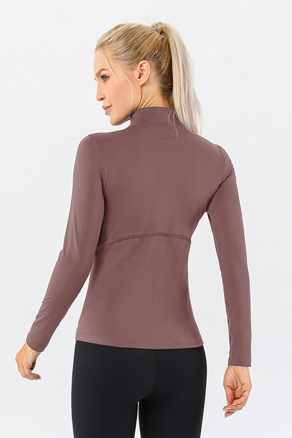 Athleisure zip-neck top in Dusty Pink with seam detail and long sleeves.