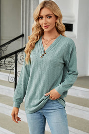 Light Green textured cable-knit henley pullover with button detail and V-neck.