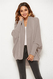 Textured cocoon knit cardigan in tan with batwing sleeves and open front.