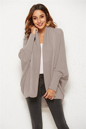Textured cocoon knit cardigan in tan with batwing sleeves and open front.