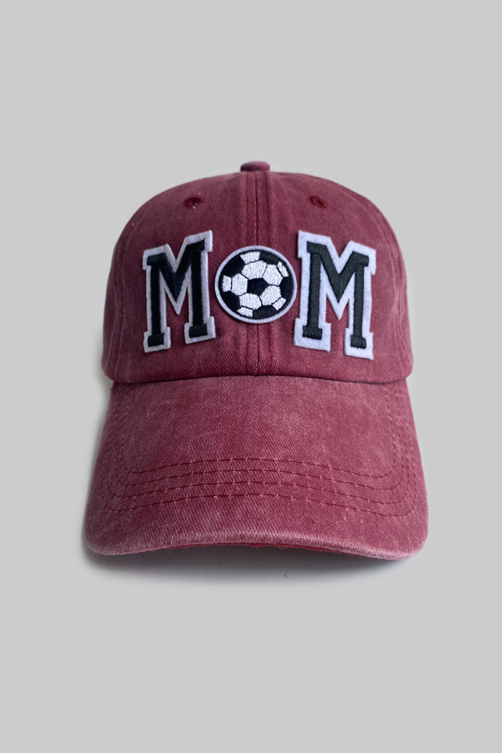 Burgundy baseball cap with embroidered MOM and soccer ball detail