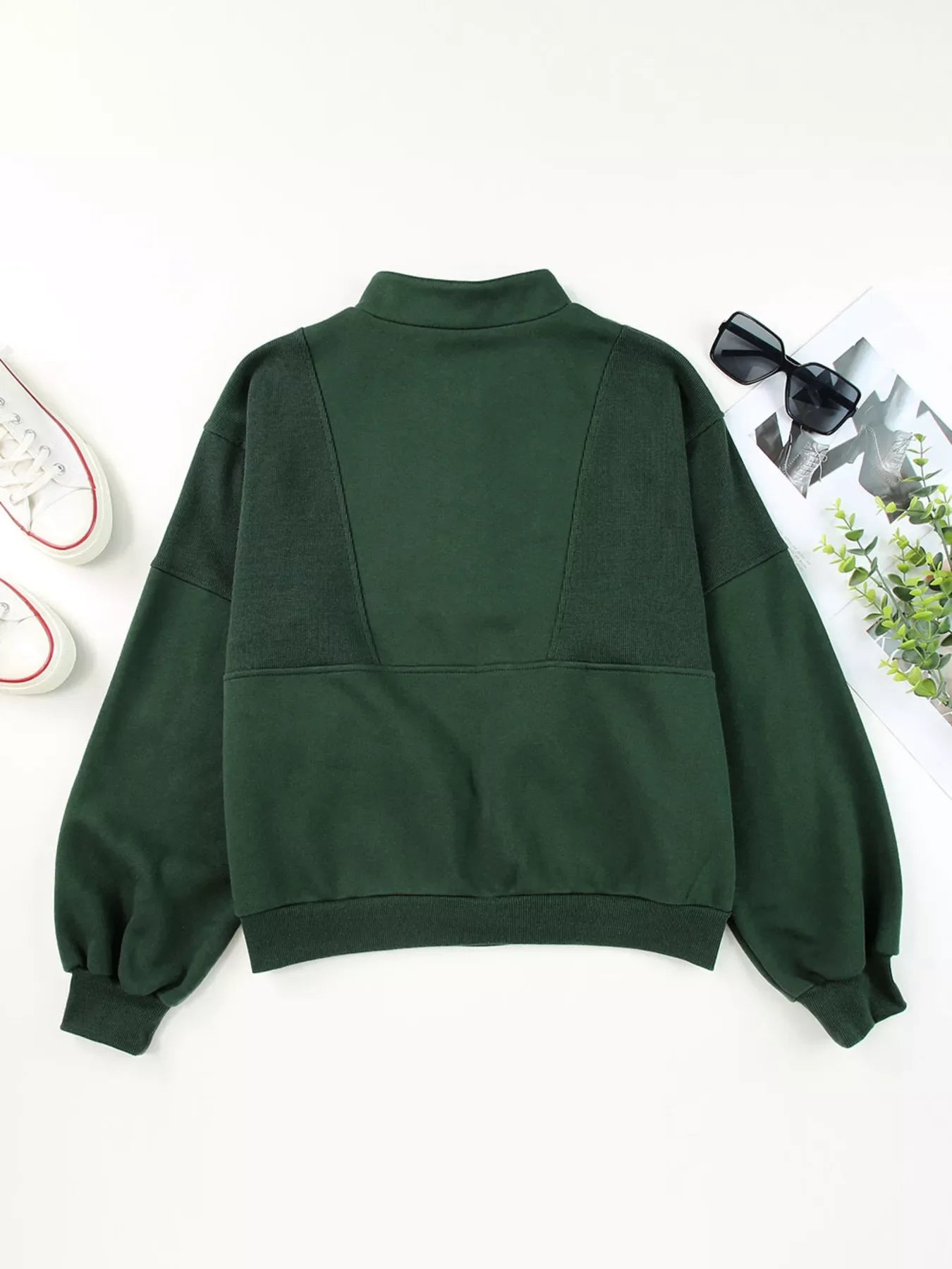 Dark green half zip stand collar sweatshirt with paneled detail