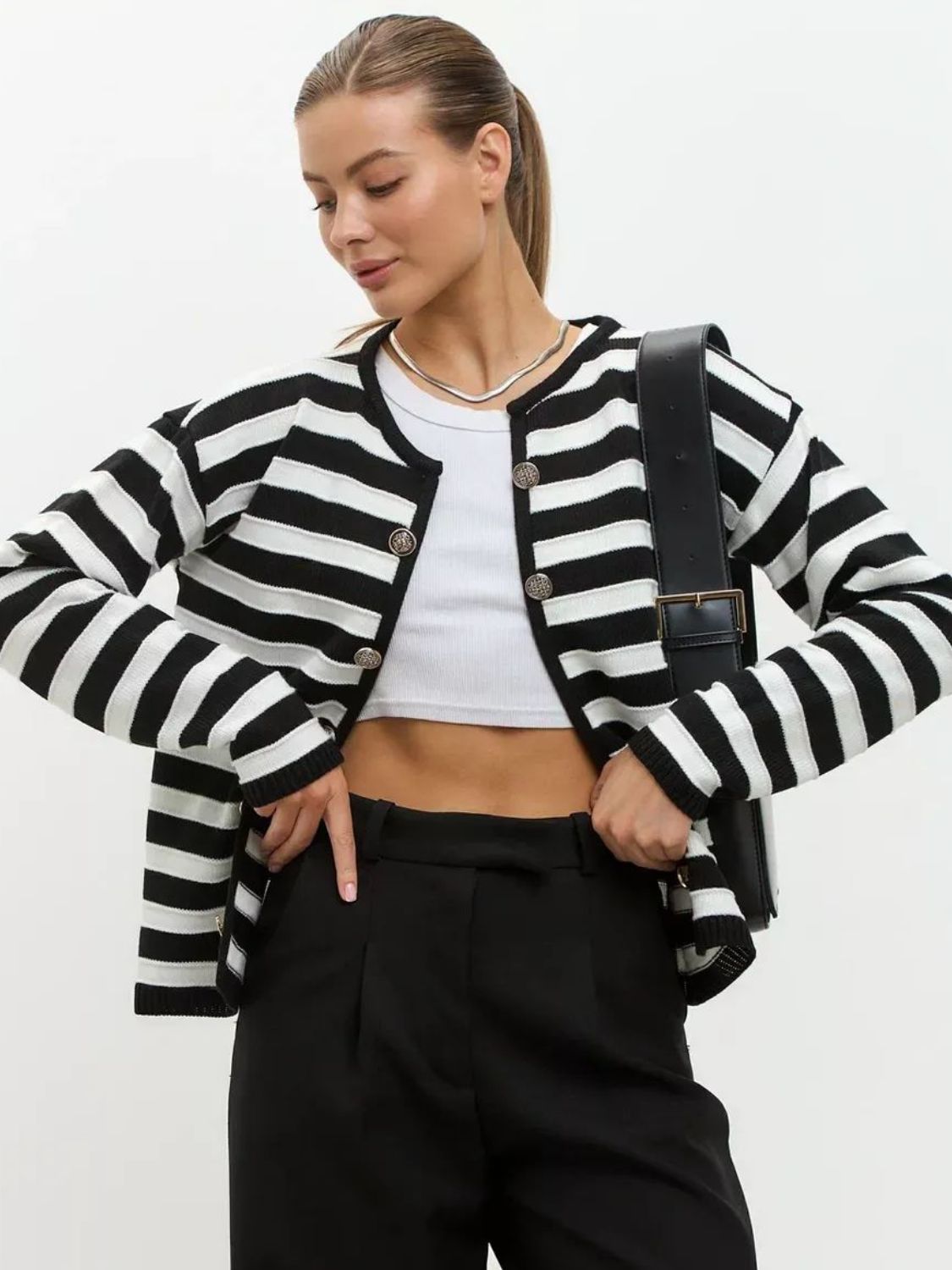 Black and white striped button-up knit cardigan with silver buttons.