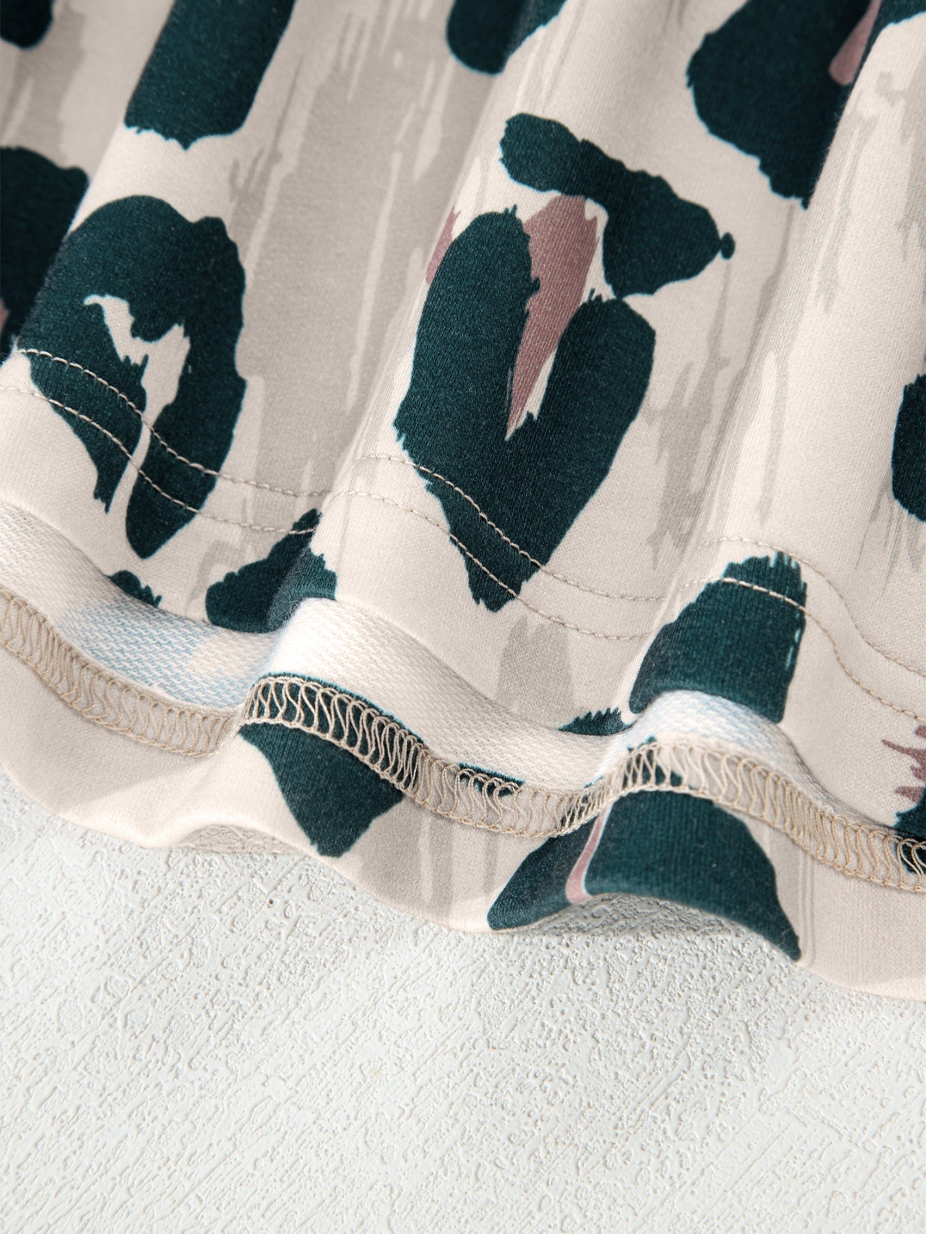 Print short sleeve blouse with animal print pattern and detailed stitching.