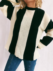 Black and cream vertical stripe waffle knit sweater with crew neck.