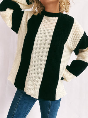 Black and cream vertical stripe waffle knit sweater with crew neck.