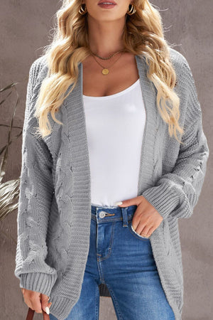 Gray cable knit open-front cocoon cardigan with textured sleeves.