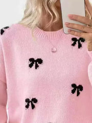 pullover sweater featuring bow-print in Apricot with 100% polyester Care instructions: Machine wash cold texture