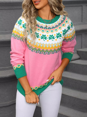 Pink knit sweater with clover pattern, crew neck, long sleeves, and green trim.