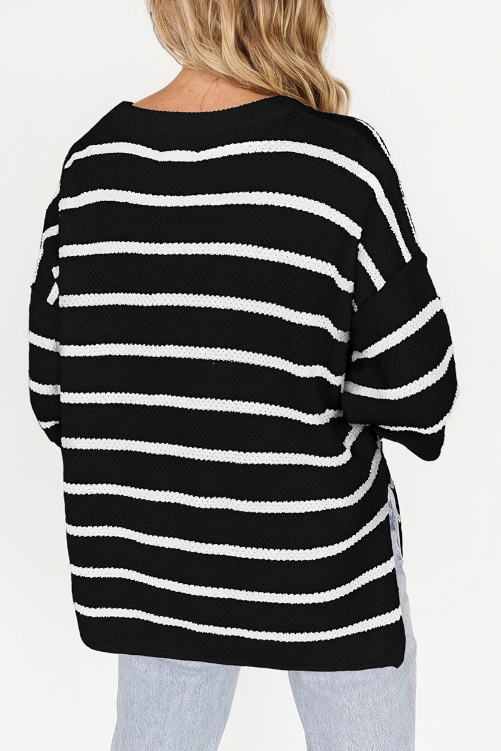 Black and white stripe knit pullover sweater with a button-down neckline.