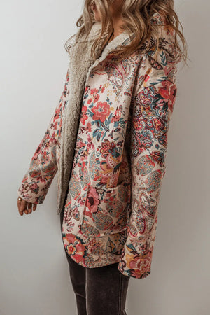 Floral paisley hooded jacket with sherpa lining and pockets.