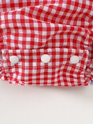 Red and white gingham baby dress with ruffled trim and white buttons