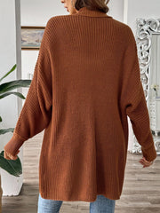 Brown ribbed knit cocoon cardigan with dropped shoulders and cuffed sleeves.