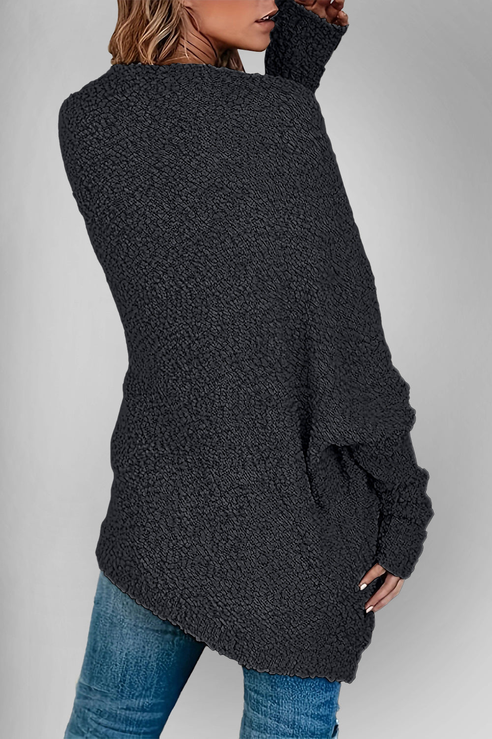 Black popcorn knit open cardigan with textured fabric and long sleeves.