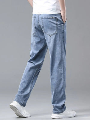 Light blue relaxed fit sweatpants with pockets and a washed denim look.