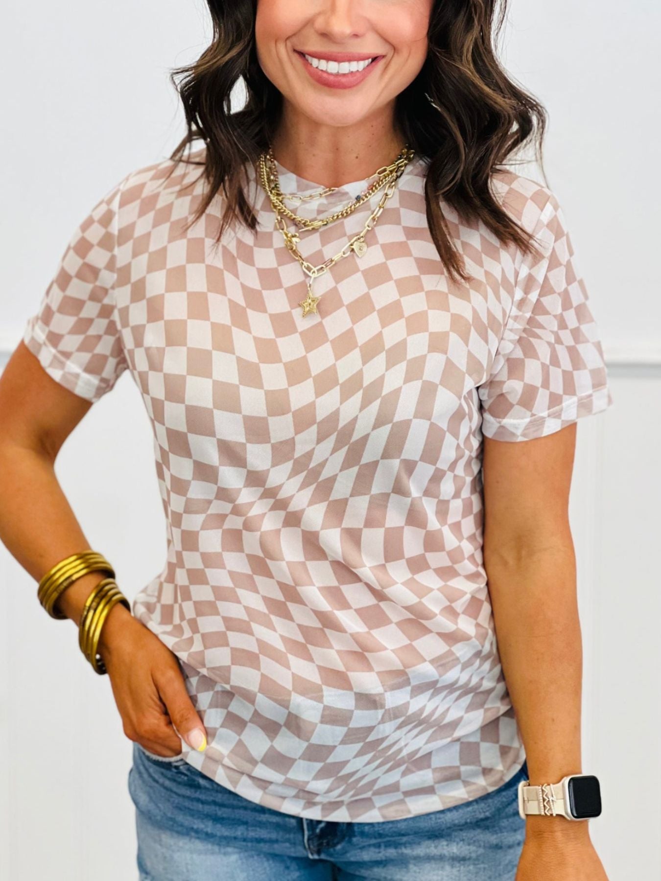 Beige checkered mesh crew neck t-shirt with short sleeves.
