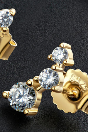 Gold moissanite cluster stud earrings with sparkling round-cut stones.