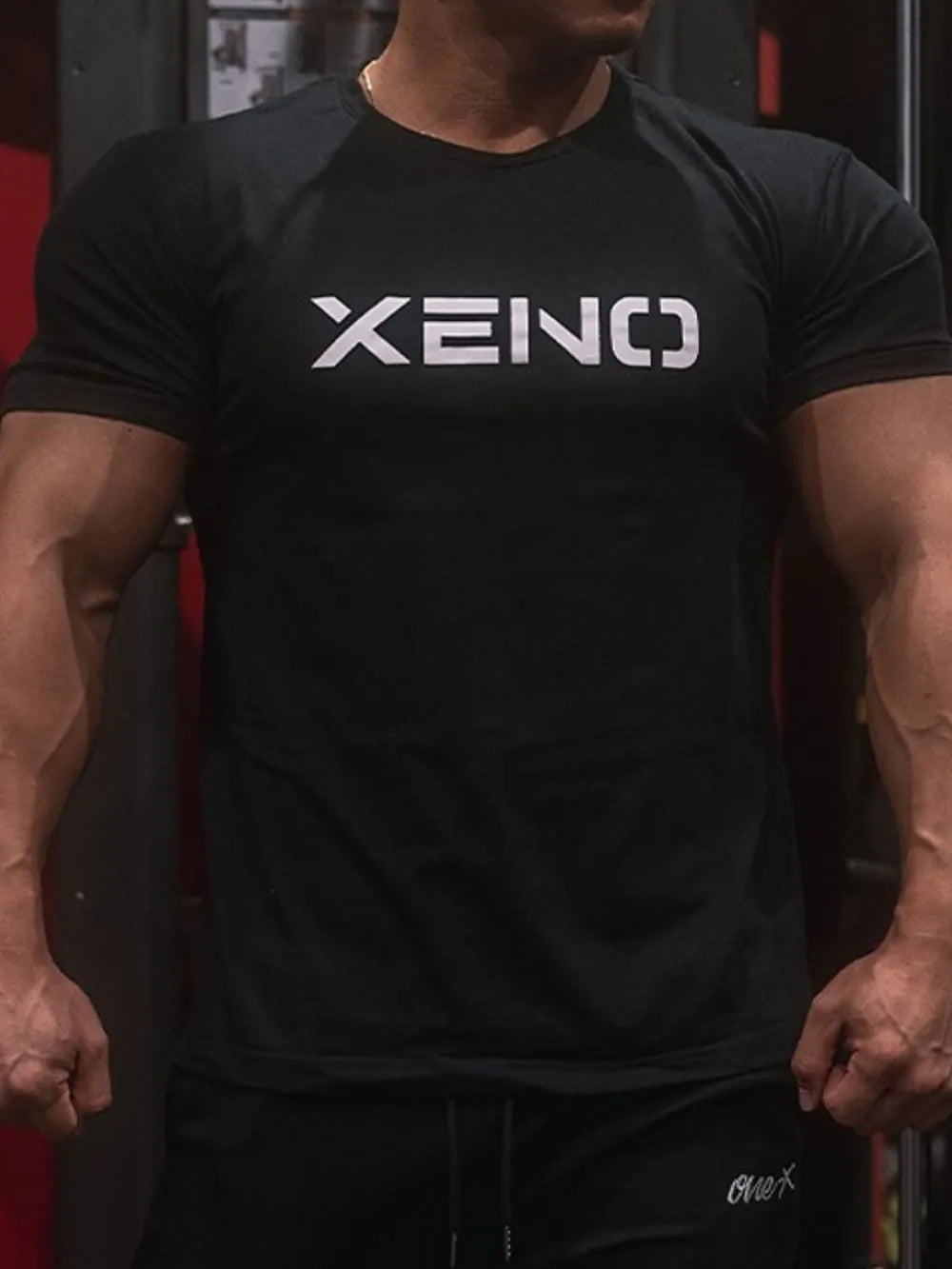Black XENO logo athletic fit t-shirt with short sleeves and crew neck.