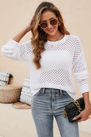 White open-knit crewneck sweater with subtle texture and long sleeves.