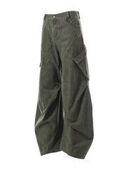 Textured paneled cargo pants in army green with a baggy fit and multiple pockets.