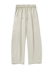 Balloon-fit drawstring trousers in taupe with a casual, wide-leg cut.