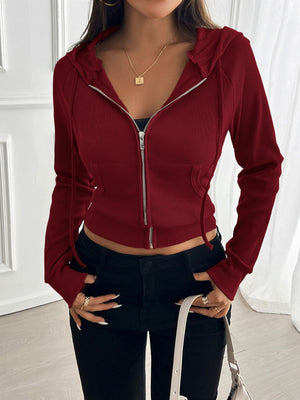 Burgundy ribbed crop zip hoodie with silver zipper and pockets.