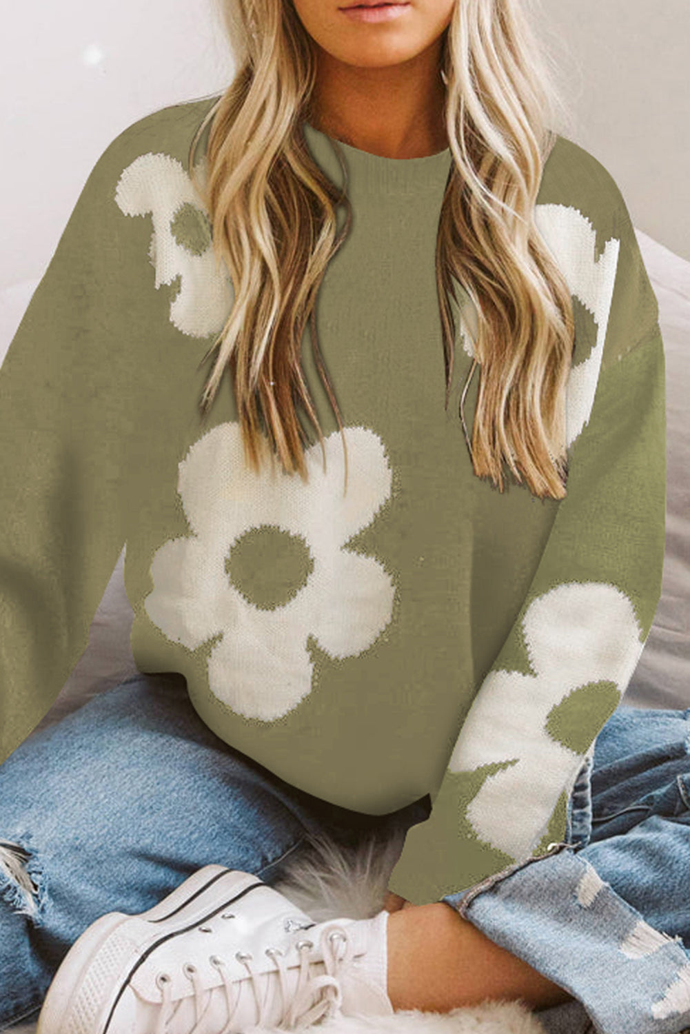 Sage acrylic knit crewneck sweater with white floral intarsia pattern.