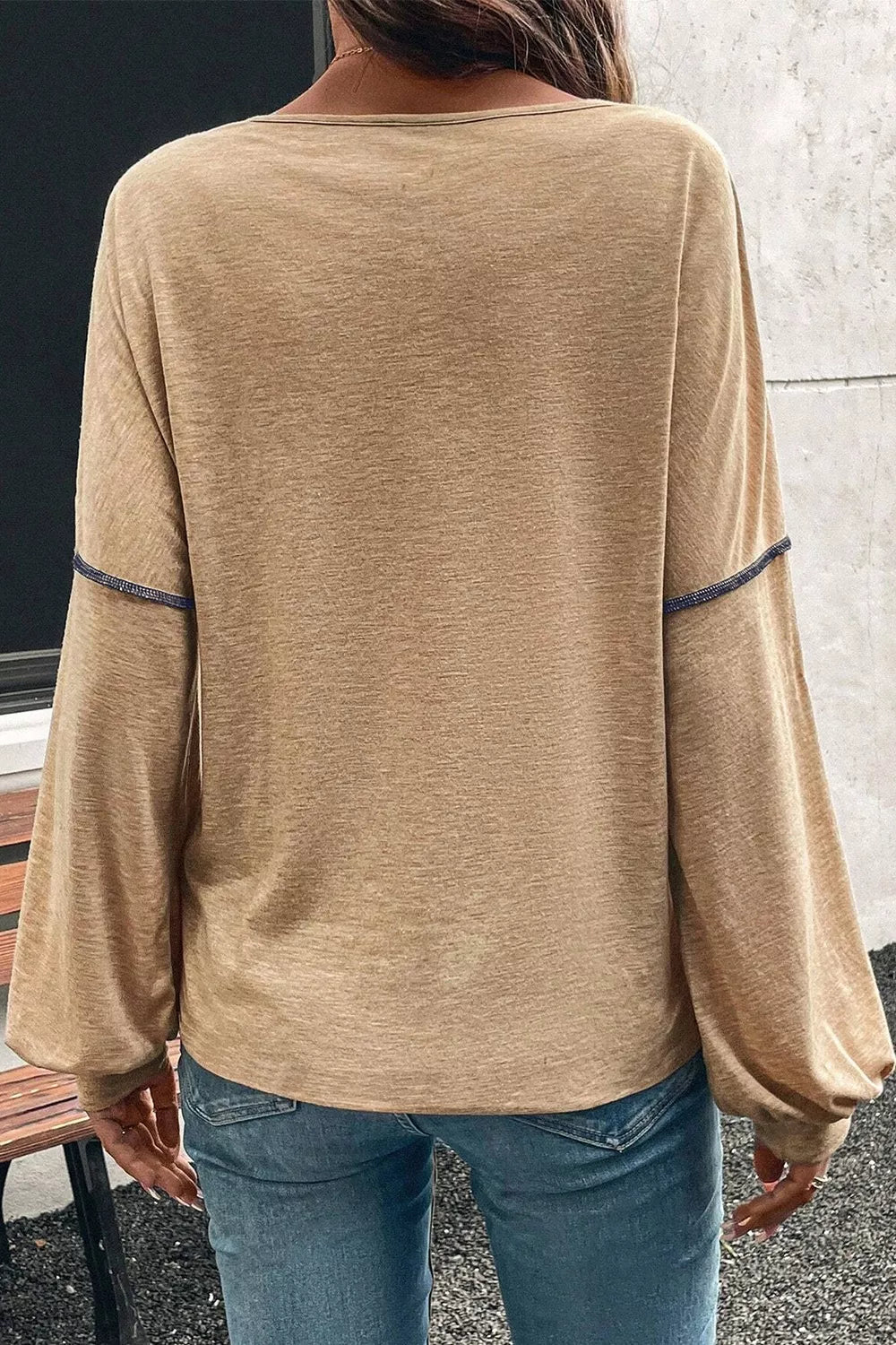 Contrast stitch v-neck t-shirt in tan with long balloon sleeves and blue stitching detail.