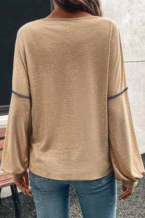 Contrast stitch v-neck t-shirt in tan with long balloon sleeves and blue stitching detail.