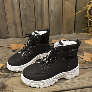 Black lace-up boots with plush white accents and buckle detail.