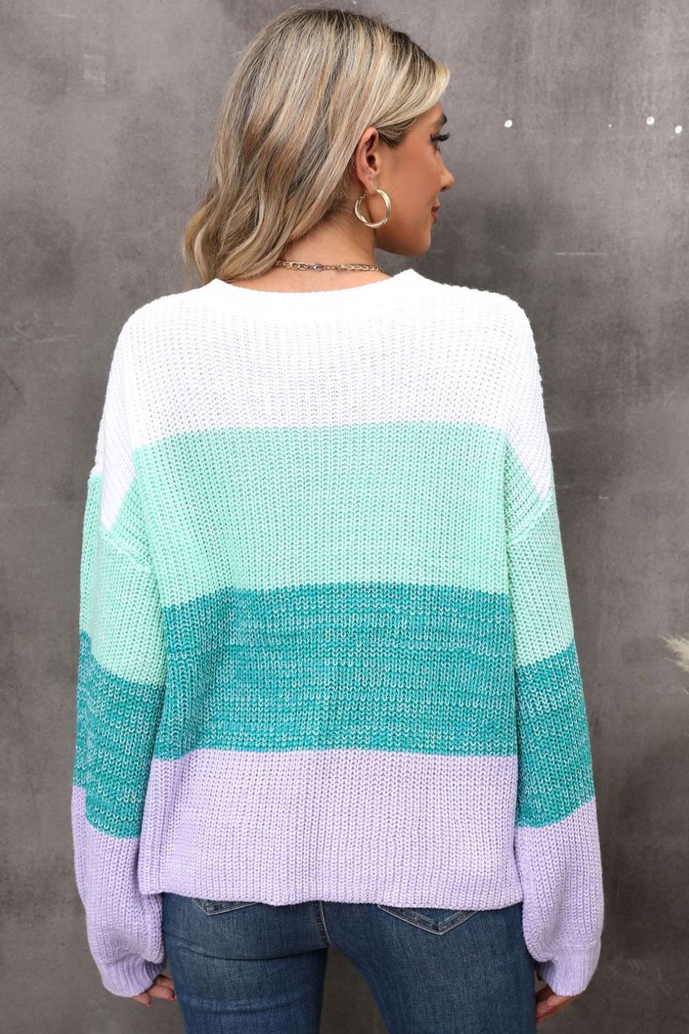 Ribbed knit sweater with colorblock stripes in white, mint, turquoise, and lavender.