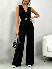 Black wide-leg jumpsuit with V-neck, elasticated waist, and gold buckle belt.