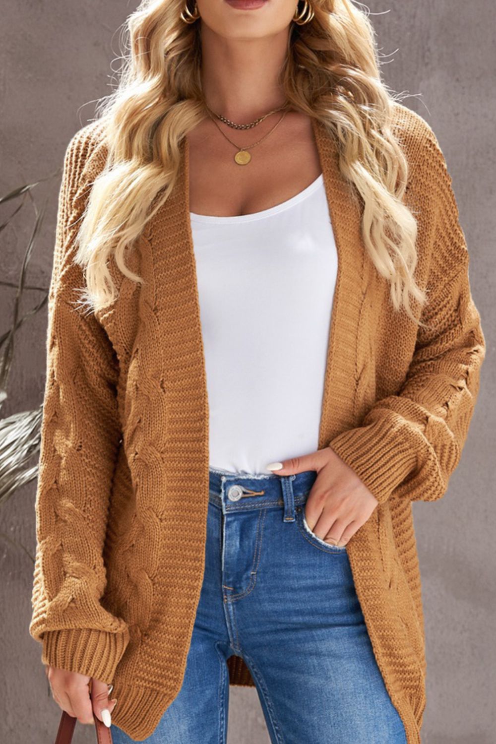Camel cable knit open-front cocoon cardigan with ribbed cuffs and hem.