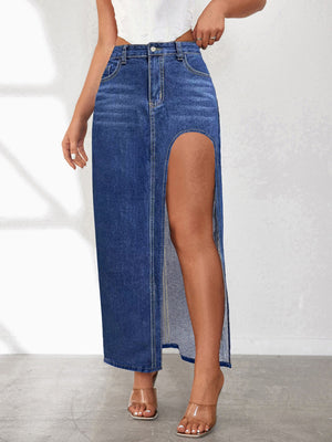 Denim maxi skirt in dark blue with a high slit and visible pocket details.