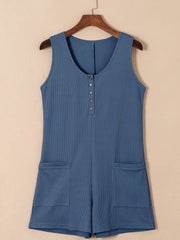 Dusty Blue waffle knit button-down romper with pockets and a scoop neckline.