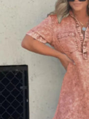 Coral short sleeve collared dress with pockets and a washed denim look.