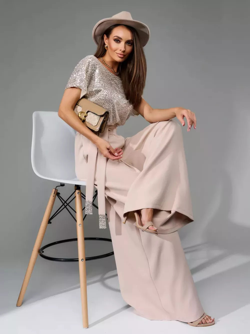 Shimmering sequin wide-leg jumpsuit with tie waist in Apricot Silver.