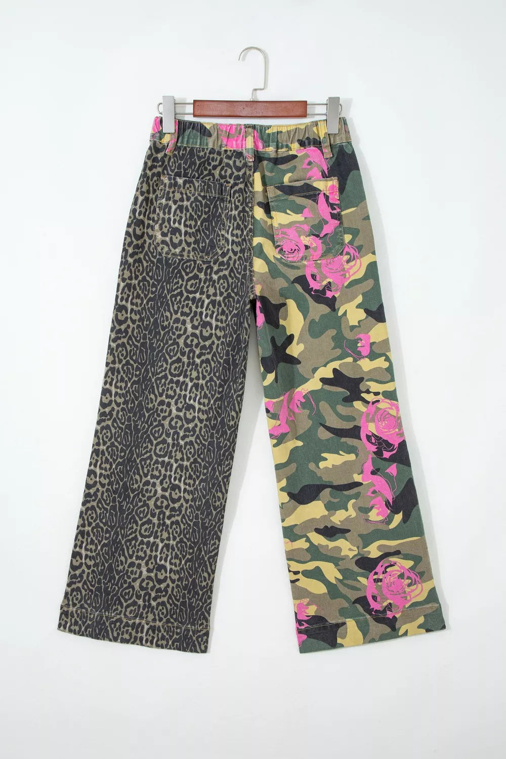 Contrast patchwork jeans with leopard print and pink floral camo design.