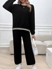 Black knit lounge set with ribbed trim on neckline, hem, and cuffs.